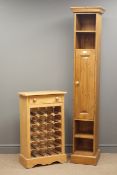 Narrow solid pine cupboard, projecting cornice, four shelves, one panelled door, plinth base,