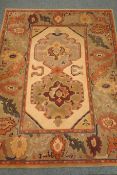 Turkish style rug, beige ground, (194cm x 144cm) and a chinese style rug, light green ground,