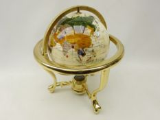 Polished stone terrestrial globe on gilt metal stand,