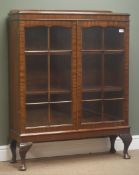 Mid 20th century mahogany bookcase, raised back, glazed doors enclosing two shelves, cabriole legs,