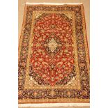 Kashan red fine ground rug, floral repeating border,