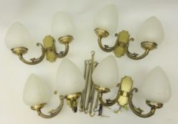 Four metal twin splayed branch wall sconces with frosted pointed glass lightshades and two metal