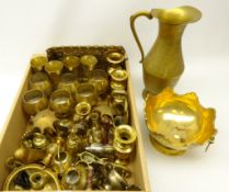 Brassware including a flower patterned jug, twin handled bowl and cups,