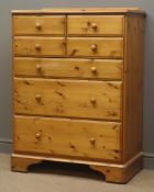 Pine chest, raised back, four short and three long graduating drawers,