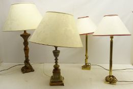 A carved metal lamp with marble plinth, another carved stem lamp and a pair of lamps,