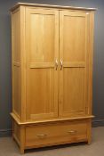 Light oak double wardrobe, projecting cornice, two panelled doors, above single drawer,