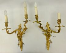 Pair Rococo style gilt metal two branch wall sconces,