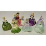 Three Royal Doulton figures 'The Bedtime Story', 'Belle',