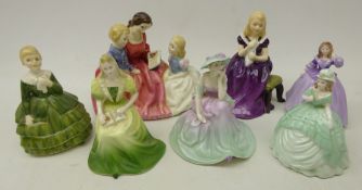 Three Royal Doulton figures 'The Bedtime Story', 'Belle',