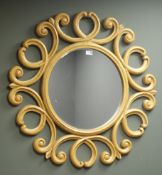 Circular bevel edged wall mirror, with scrolled frame,