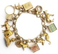 9ct gold fancy link charm bracelet with 22ct gold ring and 9ct gold charms including camera,