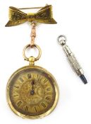 18ct gold Swiss key wound fob watch on rolled gold bow with 9ct rose gold clip