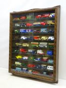 Stained wooden wall mounting die-cast display cabinet with carved frame and pair of sliding glass