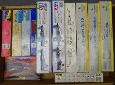 Twelve unmade aeroplane construction kits by Heller, Tamiya and Eduard, including F-5E Tiger,