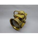 Powell & Hamner brass acetylene Motor Headlamp, the pierced shaped body with two side brackets,