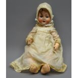 Schoenau and Hoffmeister bisque head doll with applied hair, sleeping eyes,