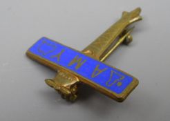 Amy Johnson Souvenir pin badge in the form of an blue enamelled aeroplane,