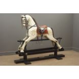 Victorian style wooden rocking horse with white painted and dappled carved sectional body,