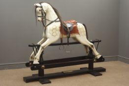 Victorian style wooden rocking horse with white painted and dappled carved sectional body,