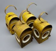 Two Raylor and two other yellow painted metal Road Works lamps,