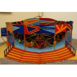Large brightly painted electrically operated scratch built wooden and metal fairground roundabout