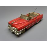 Gama 300 tin-plate friction drive open top Cadillac in red and chrome with driver L31cm