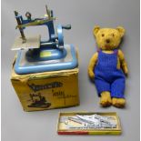 Plush teddy bear with jointed limbs, dressed in knitted blue dungarees, H40cm,