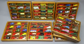 Set of eight wall hanging hardwood display cases for die-cast models each with glazed door
