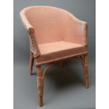 Early 20th century child's pink basketwork armchair,