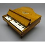 Miniature Japanese grand piano by S.K c1950s, in elm case with 15 keys on turned supports, W31.