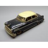 Gama 400 tin-plate friction drive Opel Kapitan saloon car in black with cream roof L25cm