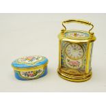 Halcyon Days miniature carriage clock of oval form with cartouche panels decorated with flowers,