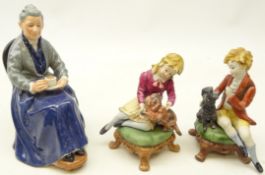 Royal Doulton figure 'The Cup of Tea' and a pair of Capodimonte figures of a girl and boy seated