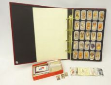 Album of Cigarette cards produced by the Card Collectors Society including Naval Dresses and Badges,