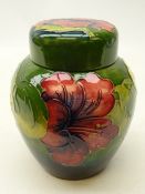 Moorcroft Hibiscus pattern ginger jar and cover on green ground,