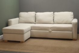 L shaped sofa bed, upholstered with cream fabric,