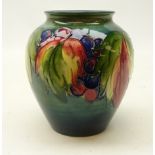 Moorcroft Grape and Leaf pattern baluster vase on green ground, with label to base,