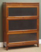 Mid 20th century mahogany three sectional stacking bookcase, three glazed up and over hinged doors,