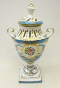 German pot pourri vase and cover with two scroll handles, hand painted panels on blue ground,