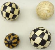 Pair decorative bone & ebony spheres and two others (4)