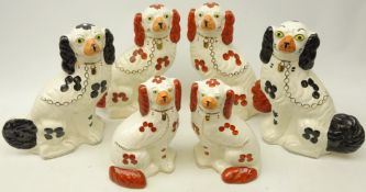 Two pairs of graduating Staffordshire style Spaniels and another pair,