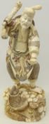 Large Chinese sectional bone figure of a Fisherman with composite head,