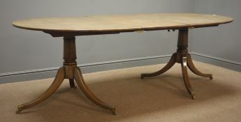 20th century medium oak twin pedestal extending dining table, turned columns on splayed supports,