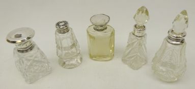 Five 19th/ early 20th century cut glass scent and smelling salts bottles,