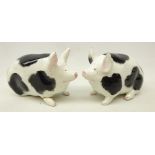 Two Wemyss pottery pig models in black and white,