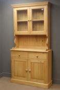 Solid pine dresser, projecting cornice, two glazed cupboards doors enclosing two shelf,