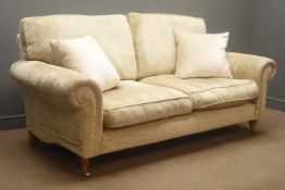 Laura Ashley two seat sofa upholstered in a beige farbric,