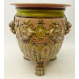 Large Victorian style jardiniere moulded with winged cherubs amongst foliage with two lion mask