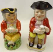 19th century Staffordshire toby jug modelled as a seated gentleman holding a jug of ale with