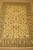 Kashan beige ground rug, floral and foliate field, repeating border,